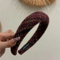 Detail view of wine red tweed padded headband with hand-made label and woven texture - Dark Red Rainbow Thread Headband