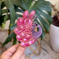 Close-up of peacock acetate hair claw clip with rhinestones and marble texture detail - Rose Pink Peacock