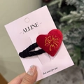 Detail of red velvet heart-shaped hair clip with golden embroidery and black band - Red Velvet Heart Firework Hair Clip