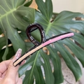 Detail view of wavy resin hair claw clip with pink and tan color block design - Strawberry Chocolate Vanilla Round Flat Style