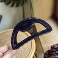 Detail of 10cm dark blue semi-circle hair claw clip showing glossy finish and metal spring - 10cm / Transparent Black