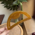 Detail of amber resin hair claw clip showing translucent texture and non-slip teeth - 10cm / Autumn Yellow