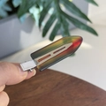 Close-up of translucent gradient resin hair clip with silver metal grip for daily styling - Transparent Dark Green Rainbow