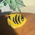 Detail of yellow acetate tropical fish hair claw clip with black stripes on wood surface - Yellow-Tropical Fish Claw