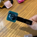 Detailed close-up of a handmade black duckbill hair clip featuring a blue marble bear - Peacock Blue Bear Duck Clip