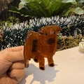 Detailed view of a brown acetate highland cow hair claw clip with glossy finish - Calf (Brown)