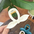 Elegant bow-shaped hair claw clips in various colors with a glossy finish for women - Solid White