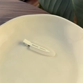 Elegant cream jelly hair clip on a decorative plate with a natural aesthetic background - Jelly White