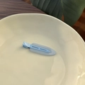 Minimalist light blue jelly hair clip on ceramic plate with aesthetic natural lighting - Sky Blue