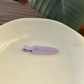 Minimalist purple matte jelly hair clip on a white plate with fresh natural background - Grape Purple