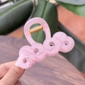 Molla per capelli rosa traslucida con motivo a onde e molla dorata su legno - Rosa Gelatina