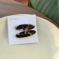 Set of two tortoise shell acetate oval hair clips with golden lettering on display card - Leopard Print