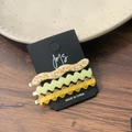 Three-piece set of elegant wave-shaped acetate hair clips in leopard, green and yellow - Mango Nougat And Translucent Yellow