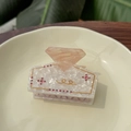 Elegant marble acetate square hair claw with crystals and gold accents on ceramic tray - Diamond Perfume Bottle Claw / Pink Marble