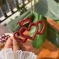 Pinza para el pelo color burdeos con diseño de triple corazón y muelle de metal dorado - Naranja Profundo Gelatina