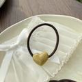 Detail of amber resin heart pendant with marble texture on dark brown hair tie - Olive Green