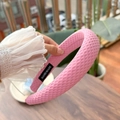 Detail of pink padded headband with waffle texture and hand made label - Sakura Pink