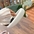 Detail of white padded headband with honeycomb mesh texture and handmade label - White Moonstone