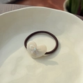 Brown elastic hair tie with cream acetate heart pendant featuring a bow and rhinestone - Moonlight White - Bow Heart Resin Hair Tie