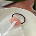 Pink oval acetate hair tie with rhinestone inlay and grid pattern on white lace - Guava Pink