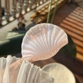Detail of iridescent shell-shaped hair claw clip with pearlescent pink finish - Sparkling Pink Clear Shell Claw