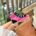 Macro detail of ice skate hair claw clip in pink marble acetate with golden blade finish - Ice Skate Shape / Rose Pink