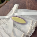 Elegant oval lace-edge hair clip in purple and yellow on a delicate lace background - Purple Hollow-Yellow Clip