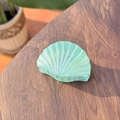 Detailed view of iridescent seashell hair claw clip with holographic mint green finish - Green Iridescent