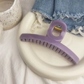 Detailed close-up of a large lavender hair claw clip on a ceramic plate for hair styling - O-Shape Bar Claw - Extra Large / Approximately 13.5cm