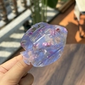 Detail of fish-shaped acetate hair claw featuring purple and pink floral patterns - Clear Blue Pink Fish