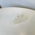 Detail of pearlescent resin hair claw clip with holographic effect and metal spring - Pearlescent White Bow Small