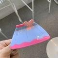 Detail of a dress-shaped hair claw clip in purple and pink with a cute bow detail - Pink and Blue Skirt Style