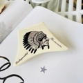 Close-up of a cream-colored acrylic hair claw featuring an Indian chief portrait design - Indian Chief