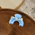 Light blue acetate hair claw clip with marble pattern bow on a wooden tray - Small / Sky Blue Bow Style