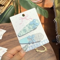 Blue ballet style hair clips with bows and stars on display card for women - Sea Salt Blue - Bow Style