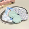 Detailed macro view of a floral plaid scrunchie with light green and purple fabric - Purple Plaid and Cyan Floral Patchwork Scrunchie