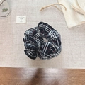 Classic black, white and red plaid hair scrunchie on a neutral aesthetic linen background - Black and White Plaid Pleated Style