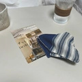 Japanese style striped blue and white fabric hair accessory on a minimalist desk - Blue Striped Triangular Hair Clip