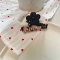 Detail view of handmade tortoise shell flower hair claw with black floral accent - Approx 6cm / Black Flower - Pink Ink