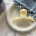 French style cream colored large hair claw clip with matte finish on a ceramic plate - Creamy Yellow Round Arc Large