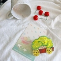 Detail shot of a cute green cloud car hair claw clip on a white decorative background - Cauliflower Cart
