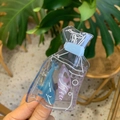 Close-up of ocean-themed acetate hair claw with blue dolphin and purple seashell decor - Transparent Bag Whale Style