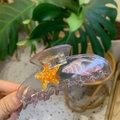Detail of purple acetate hair claw clip with starfish and seashell patterns - Transparent Pink Conch Shell Style