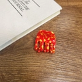 Close-up of red and yellow star hair claw clip on a wooden desk with a white journal - Star Red - Square Ponytail Claw (Approx. 3.5cm)