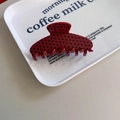 Retro red acetate hair claw clip with black polka dots shown on a white display tray - Plum Red With Black Polka Dots
