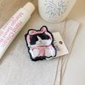Detailed view of a cute cartoon cat hair claw clip with pink hoodie on a cozy background - Pink Fur Cow Cat Hair Claw