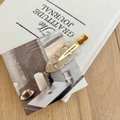 Detail of French acetate hair clip with marble pattern and gold metal fastener - White Marble
