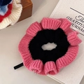 Detailed texture of pink and black knit scrunchie next to gratitude journal - Strawberry Pink-Black