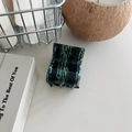 Detailed view of large marble texture hair claw clip with acetate finish and metal spring - Emerald Green Marble
