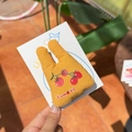 Yellow rabbit-ear hair clip with tomato pattern on a white display card - Orange Rabbit Tomato Clip